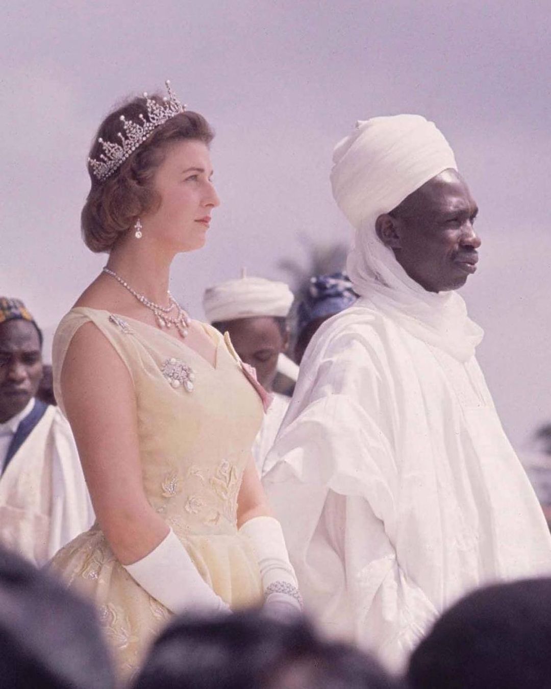 A distinguished person in regal, textured African attire embodying cultural restraint and intentional style.