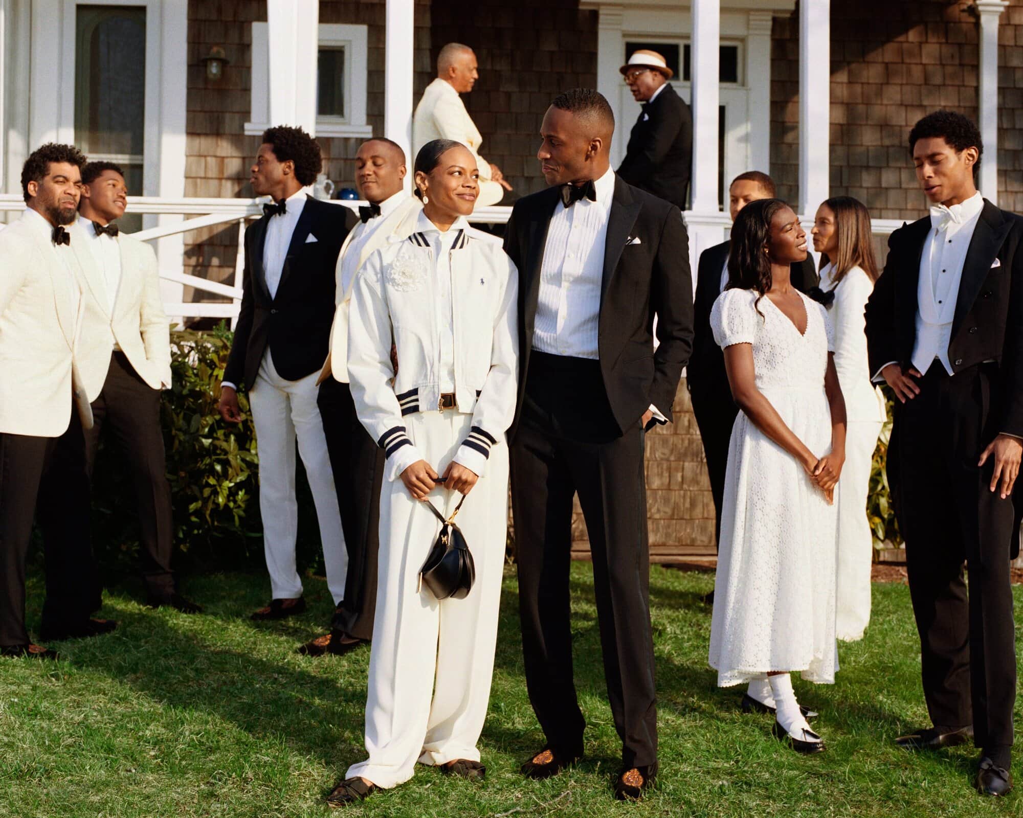 A group of stylish, professional Africans conversing in a modern, luxury Lagos members club setting.